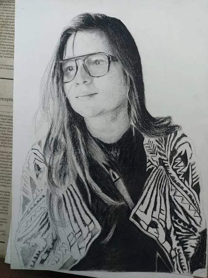 Charcoal sketch with glasses by Deepak - portrait artist Delhi