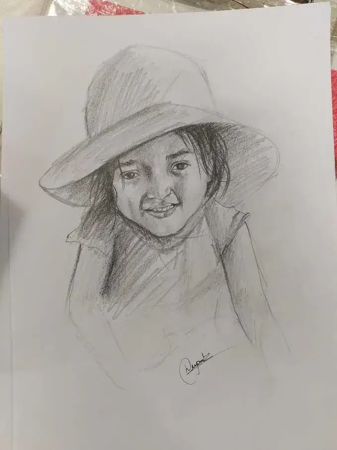 Child portrait pencil sketch with hat by Deepak - artist Delhi