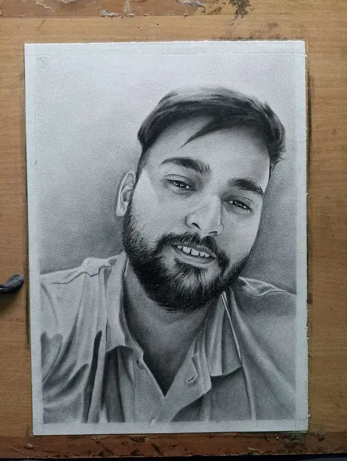 Completed charcoal portrait after