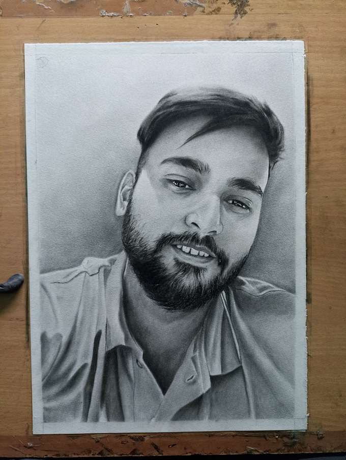 Completed charcoal portrait after