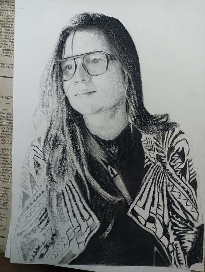 Charcoal sketch with glasses by Deepak - portrait artist Delhi